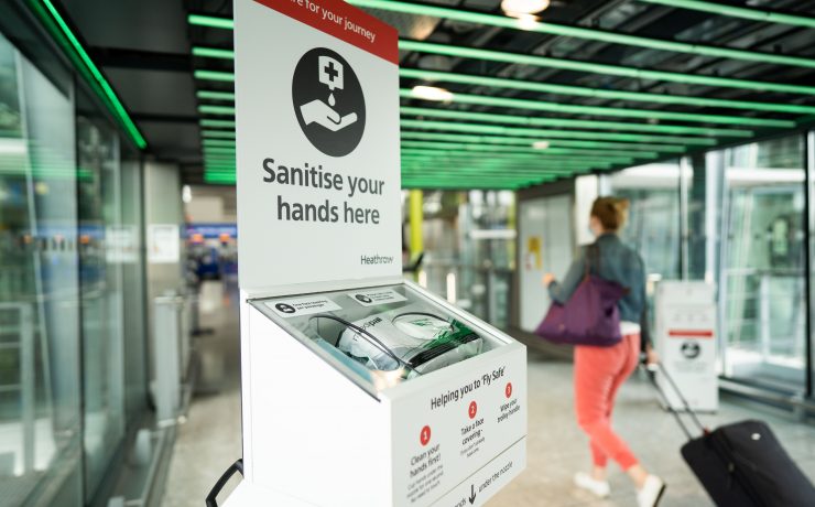 a hand sanitizer dispenser in a public place