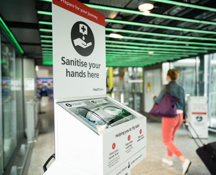 a hand sanitizer dispenser in a public place