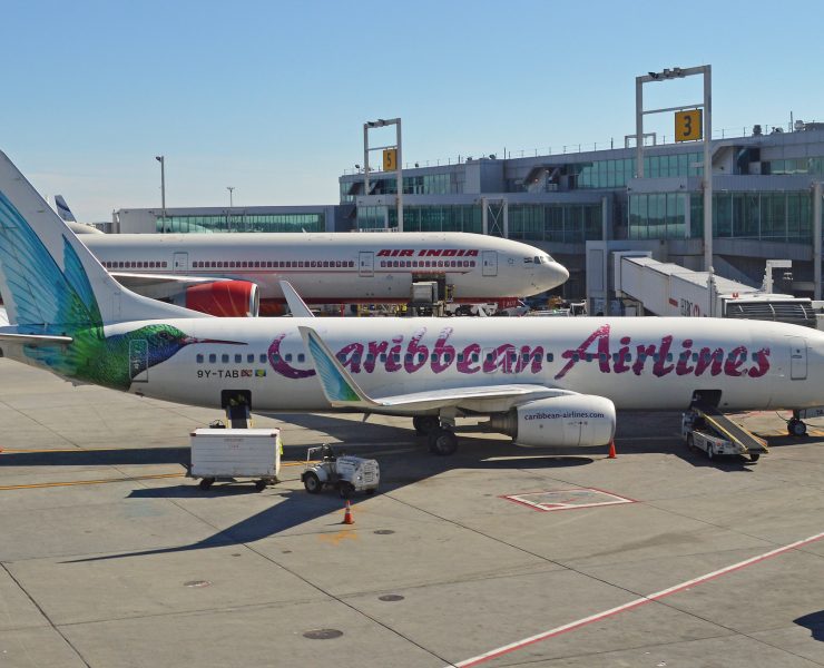a group of airplanes at an airport