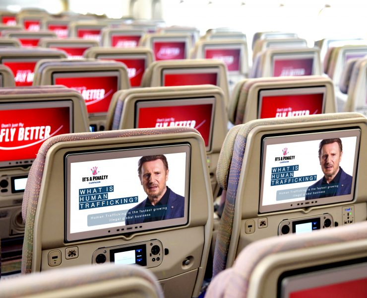 a row of seats with screens on the back