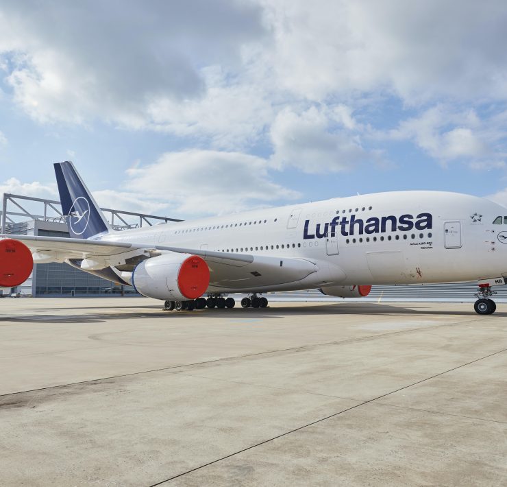 a large white airplane on a tarmac