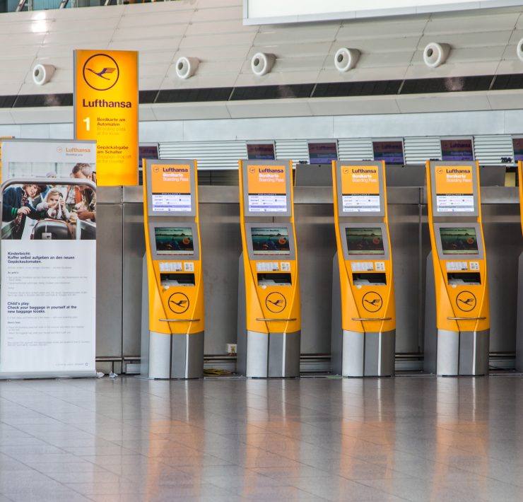 a row of yellow and orange kiosks