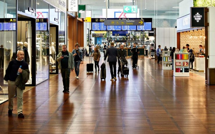 people walking in a large airport