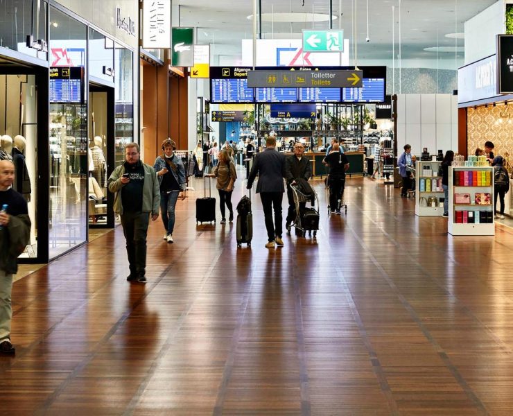 people walking in a large airport