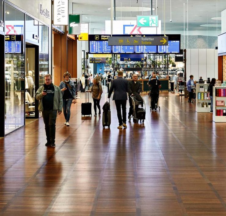 people walking in a large airport