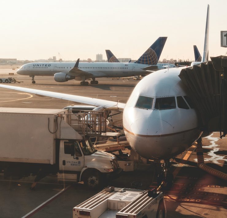 a group of airplanes at an airport