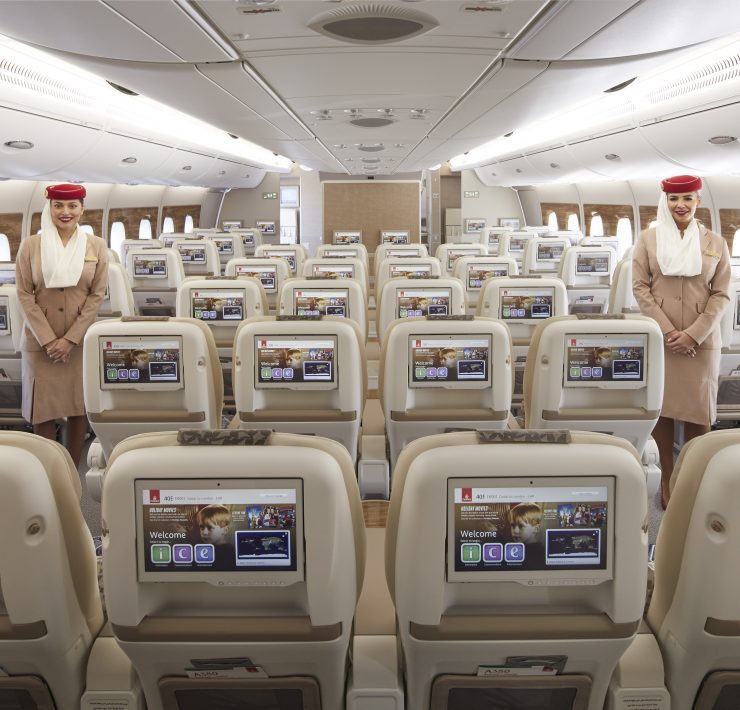 a group of people standing in an airplane