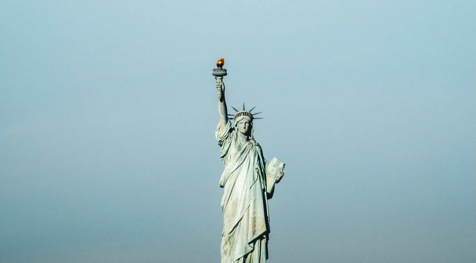 a statue of a woman holding a torch