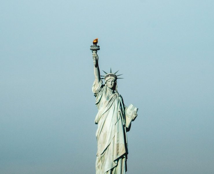 a statue of a woman holding a torch