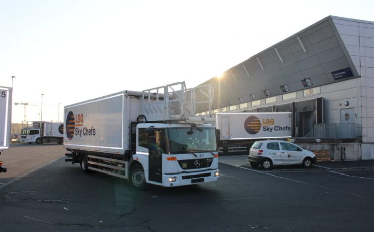 a truck and cars in a parking lot