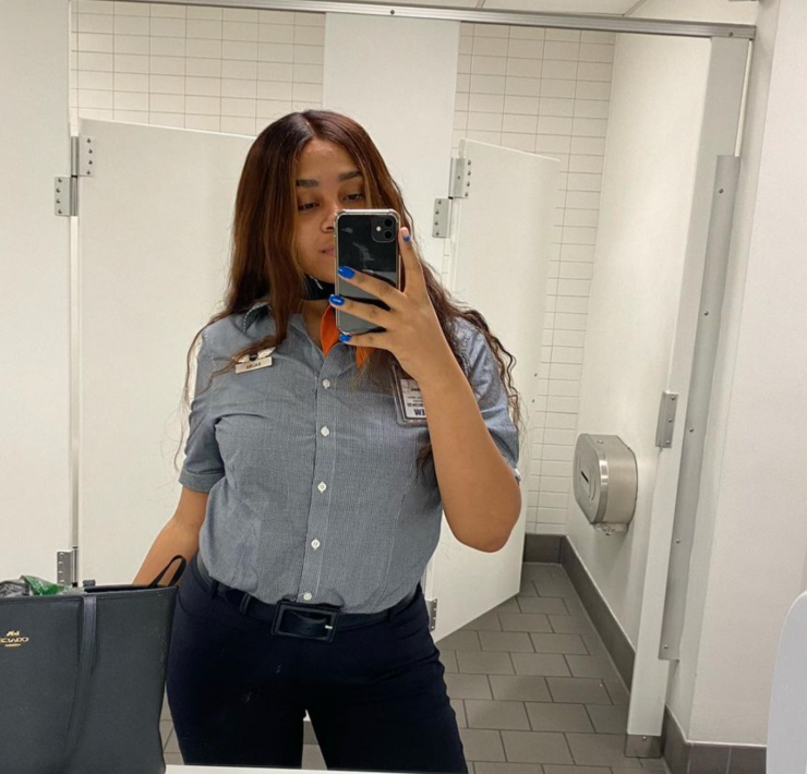 a woman taking a selfie in a mirror