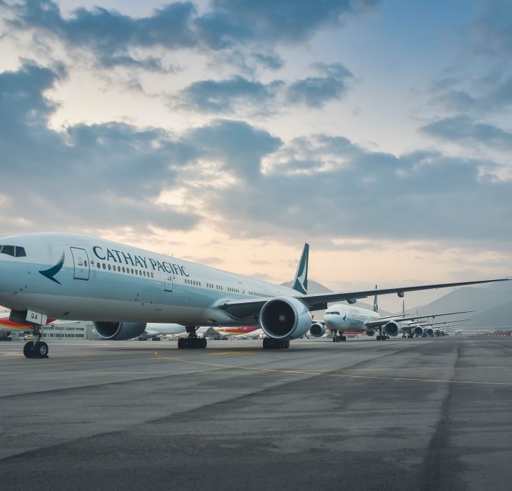 a group of airplanes on a runway