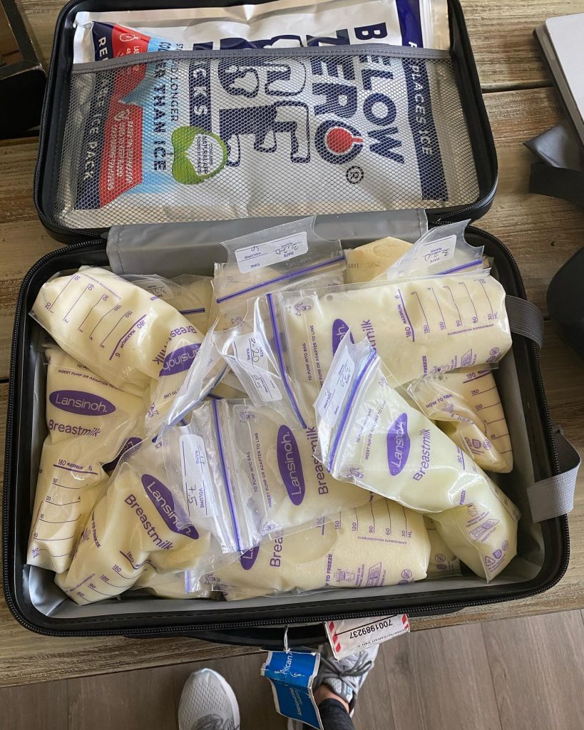 a plastic bags of breast milk in a black container