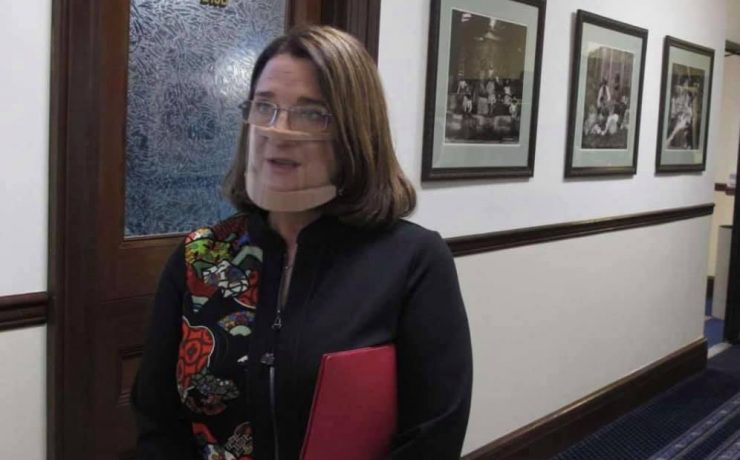 a woman with a bandage over her face