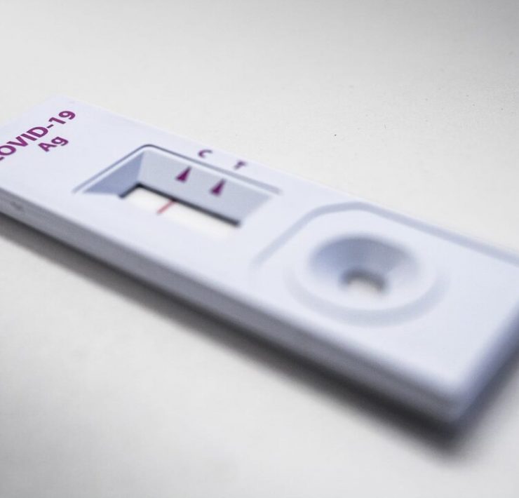 a white rectangular object with red text