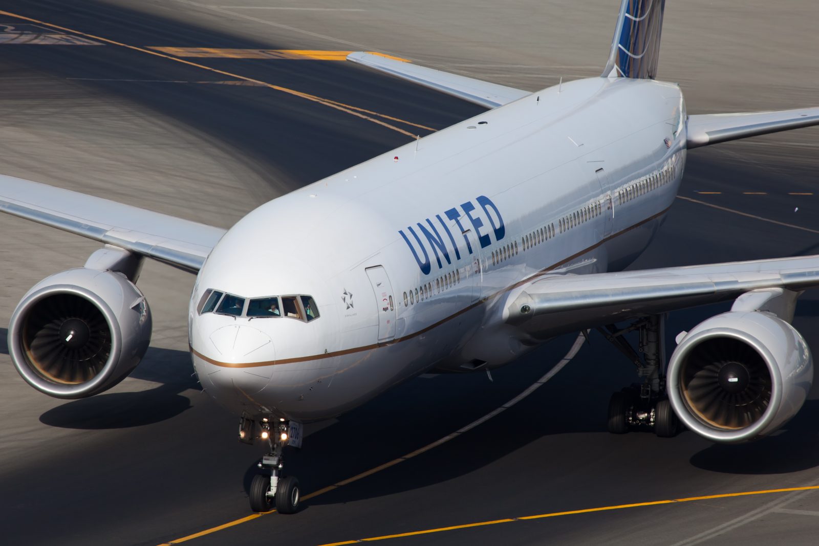 a white airplane on a runway