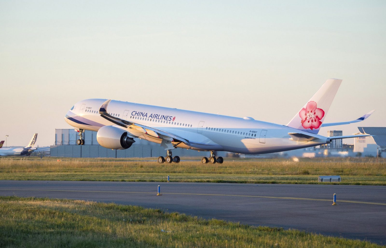 a white airplane on a runway