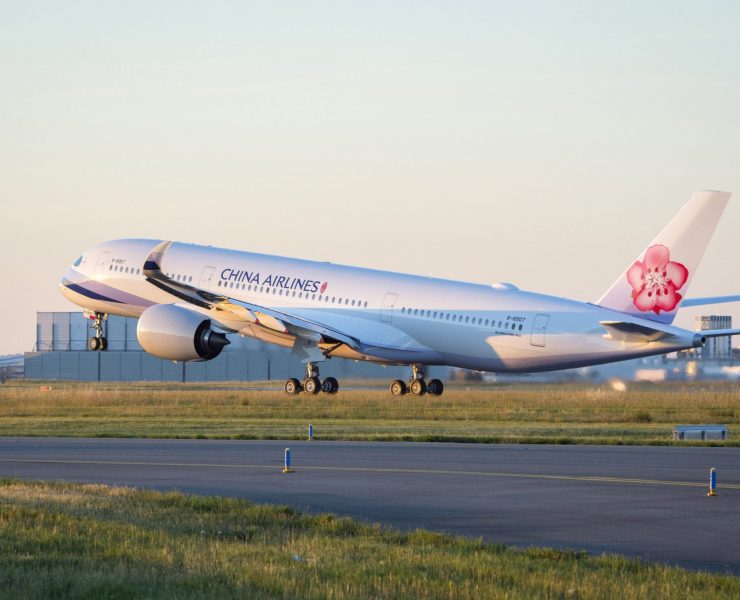 a white airplane on a runway