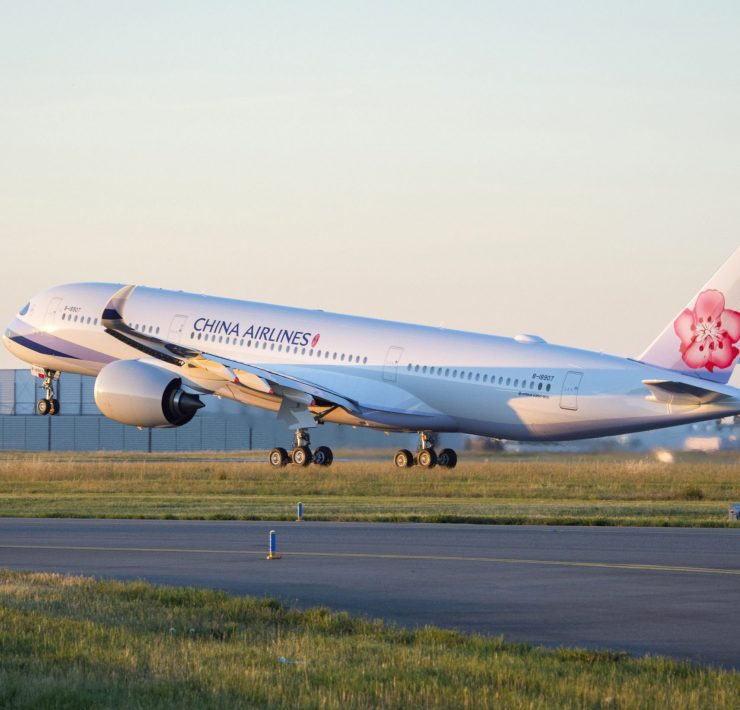 a white airplane on a runway