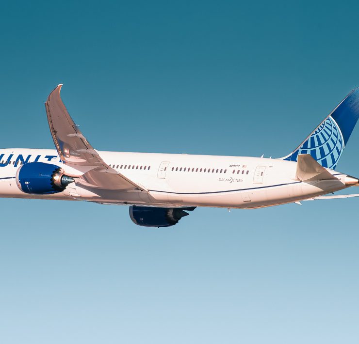 a white airplane in the sky