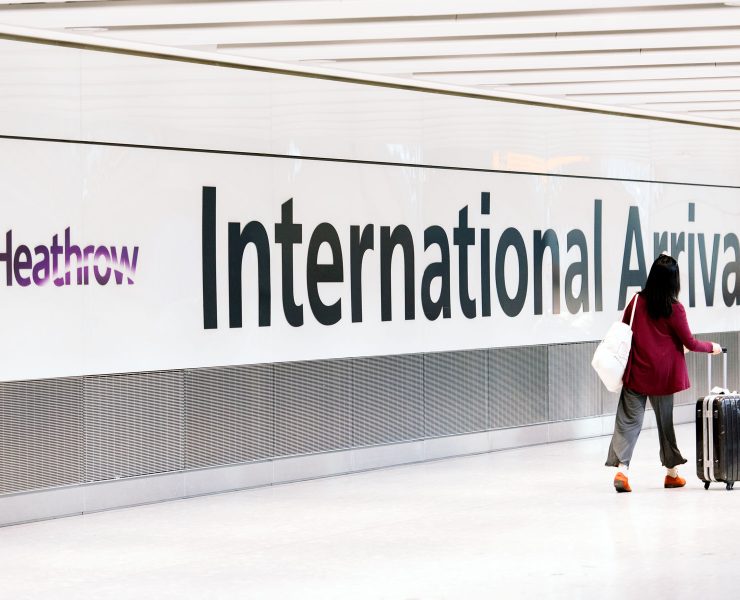 a woman walking in a hallway