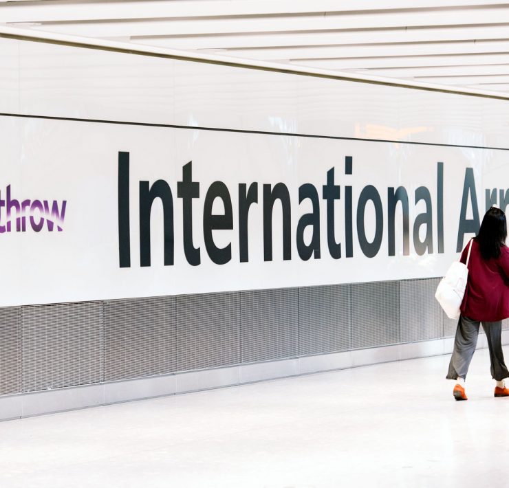 a woman walking in a hallway