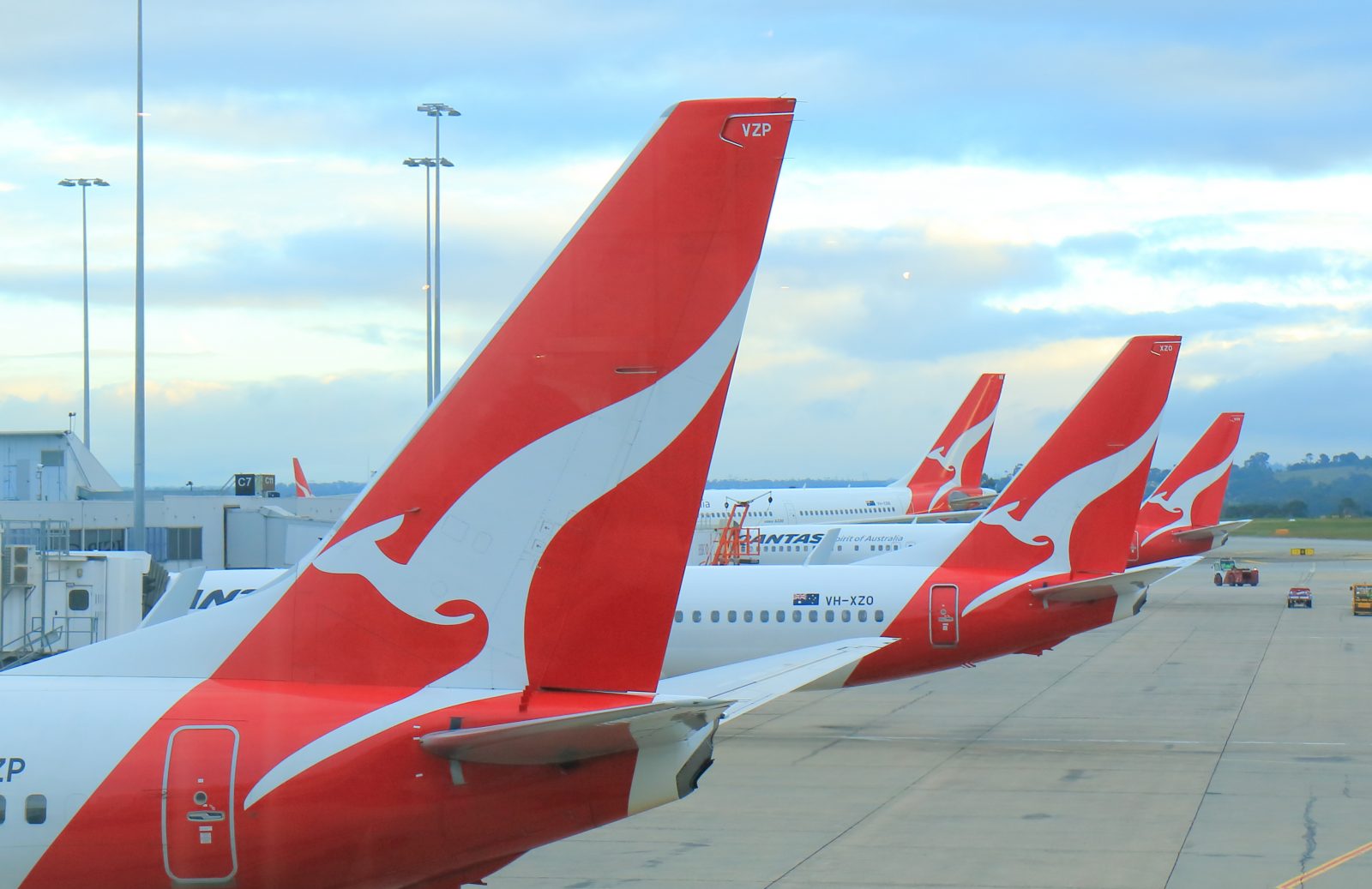 red and white airplanes with a white design on the tail