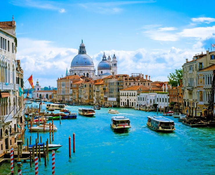 boats on a canal in a city