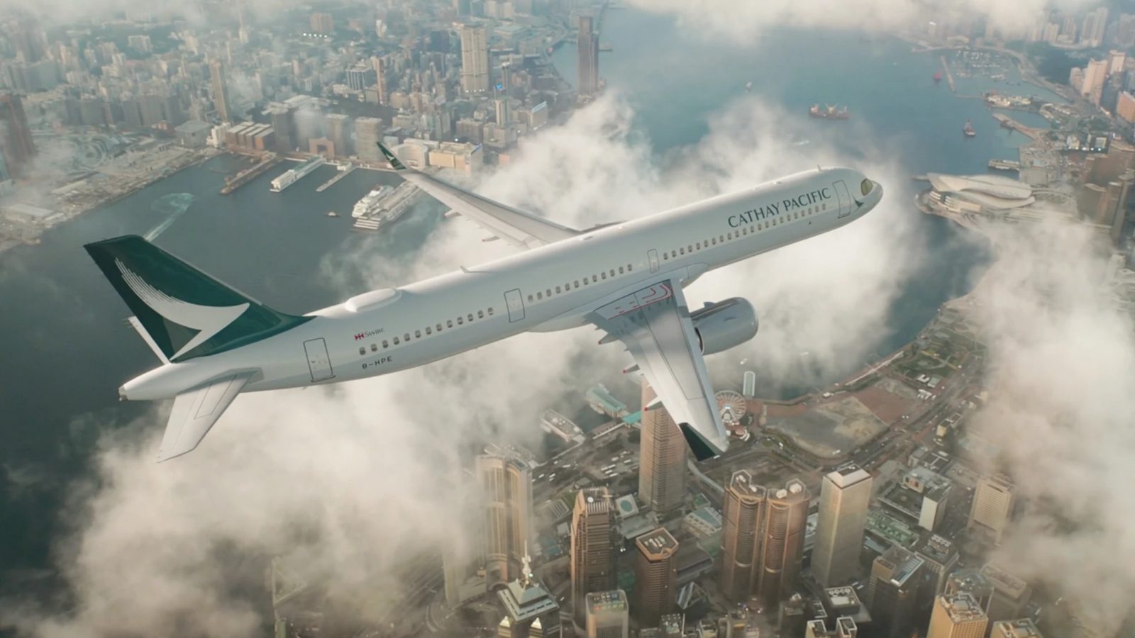 an airplane flying over a city
