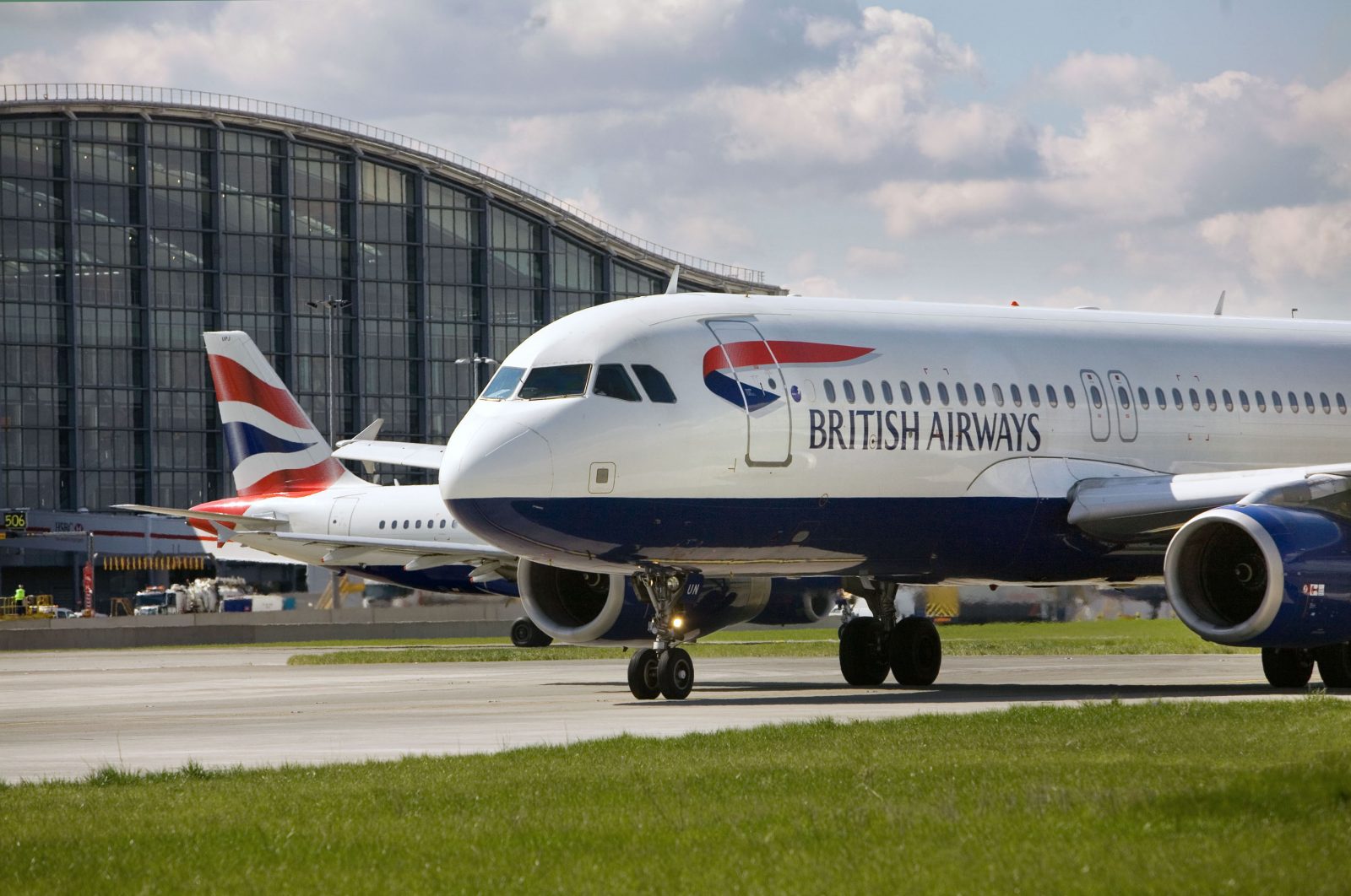 two airplanes on the runway