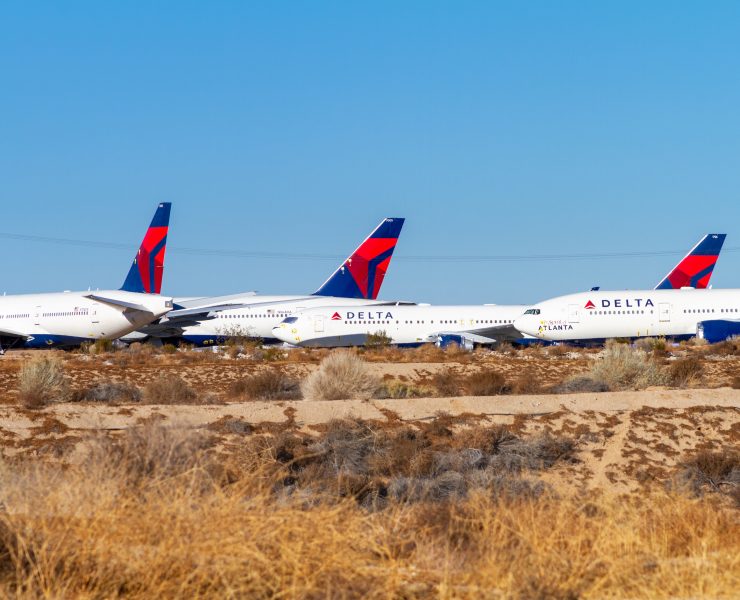 a group of airplanes in a field