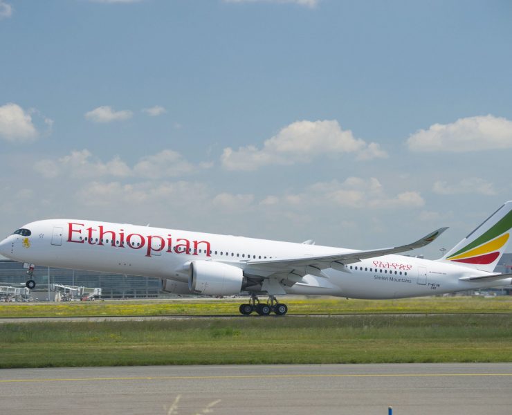 a large white airplane on a runway
