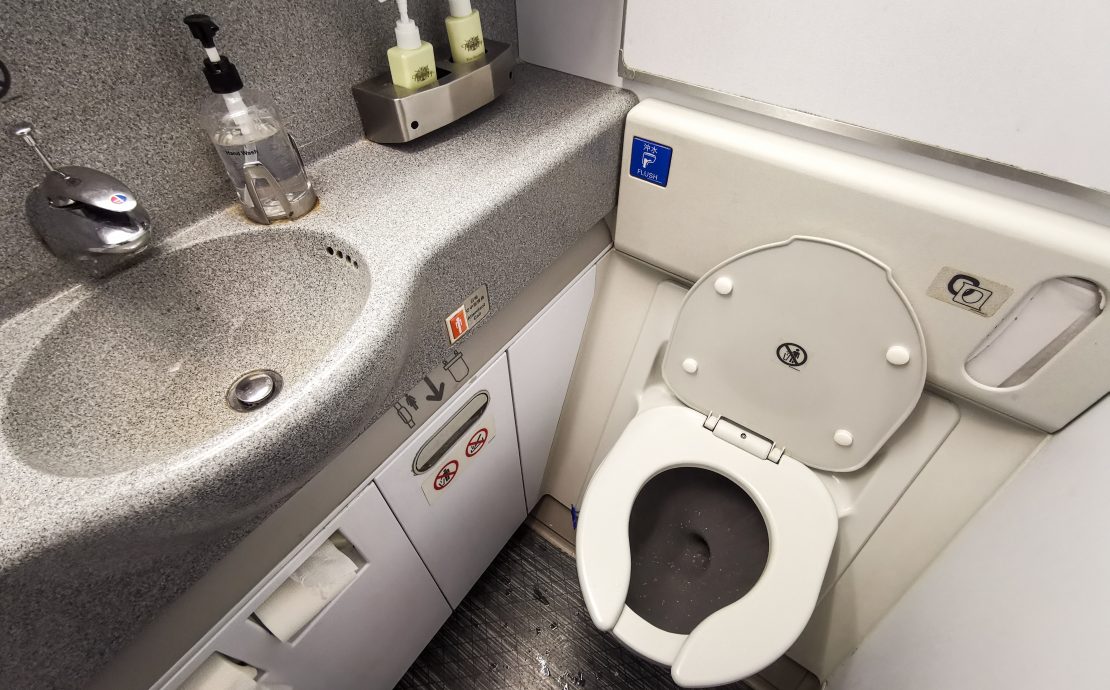 a toilet and sink in a bathroom