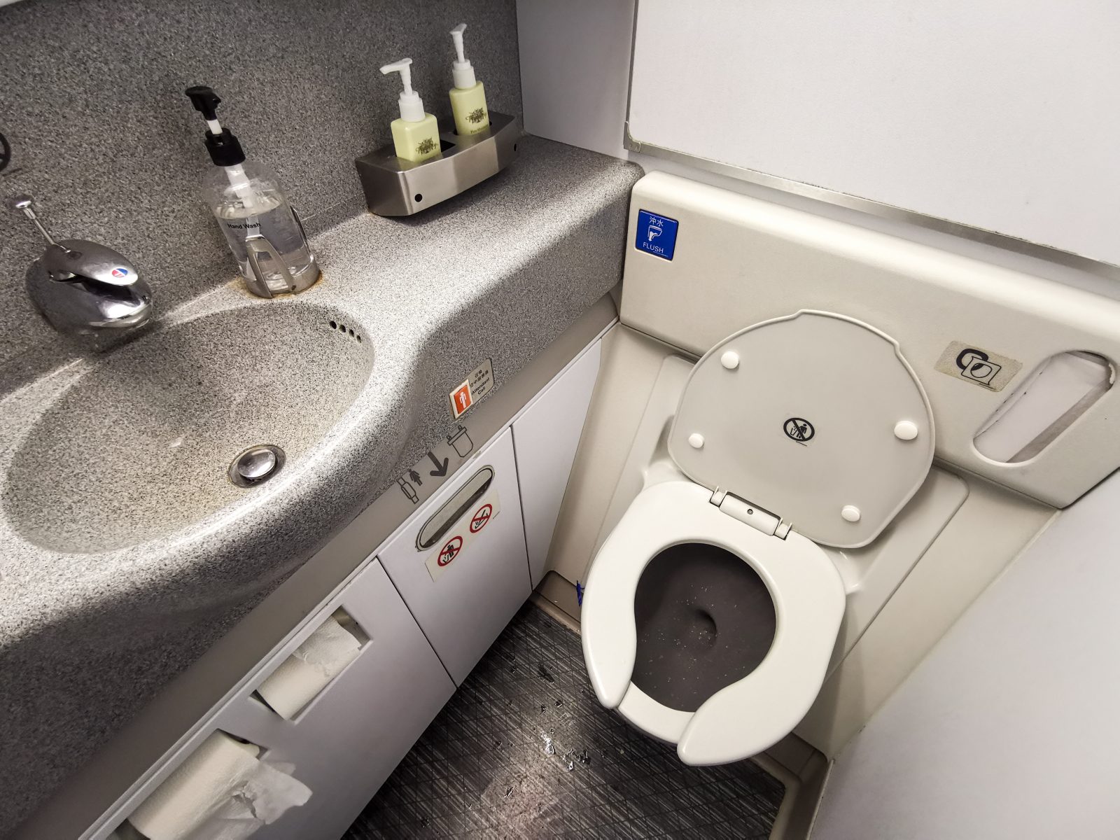 a toilet and sink in a bathroom