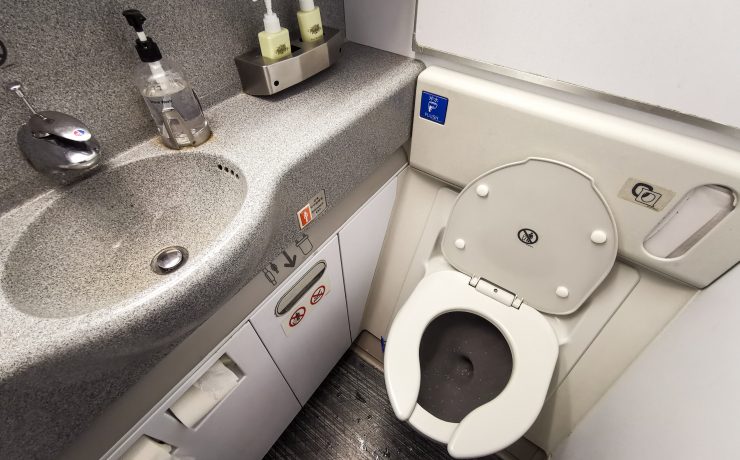 a toilet and sink in a bathroom