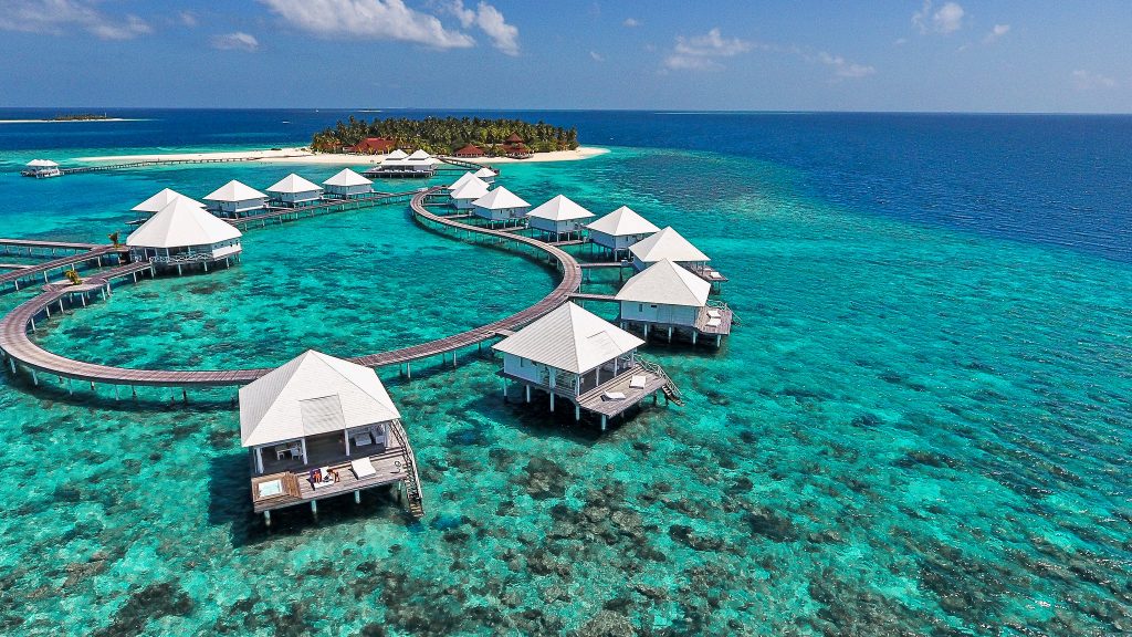 a group of huts on water