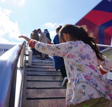 A young Afghan refugee boards a Delta Air Lines plane at Ramstein air force base in Germany bound for the United States