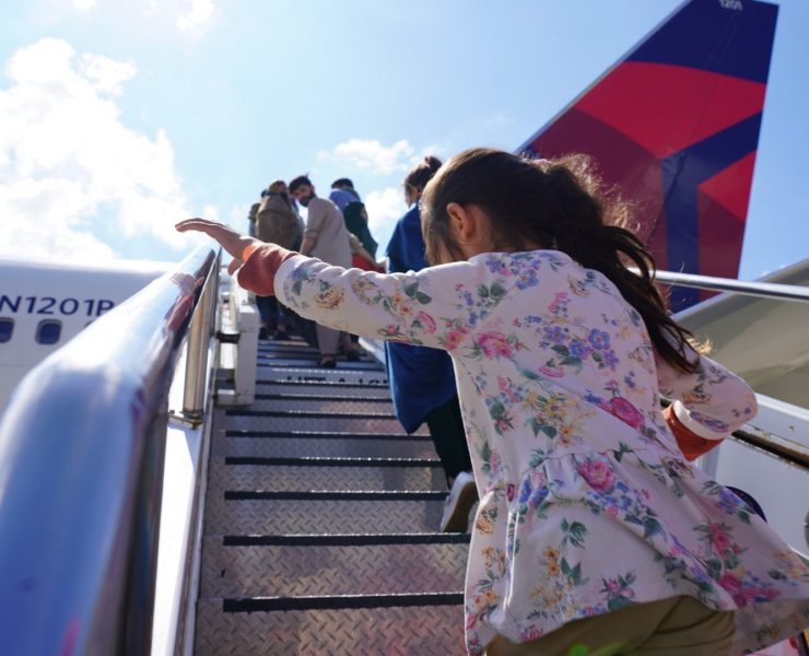 A young Afghan refugee boards a Delta Air Lines plane at Ramstein air force base in Germany bound for the United States