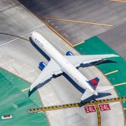 A Delta Air Lines aircraft, seen from above, taxis on the tarmac at Los Angeles International Airport