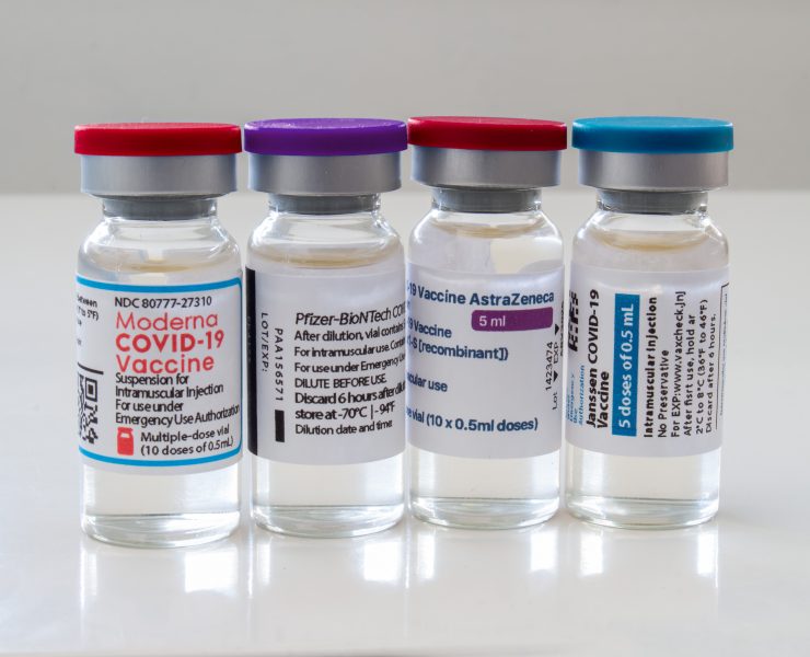 a group of vials with labels