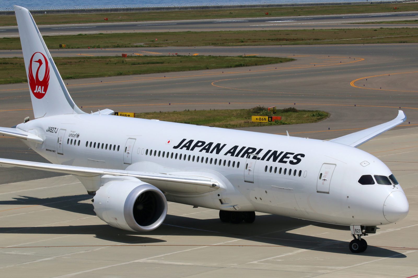 a white airplane on a runway