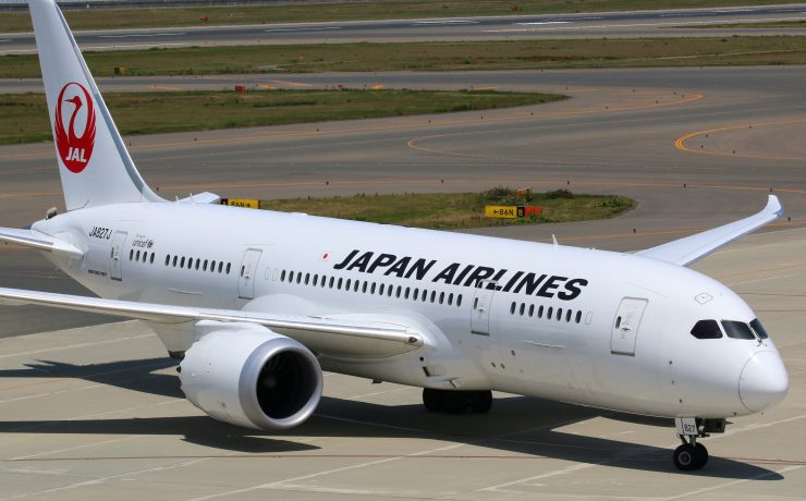 a white airplane on a runway