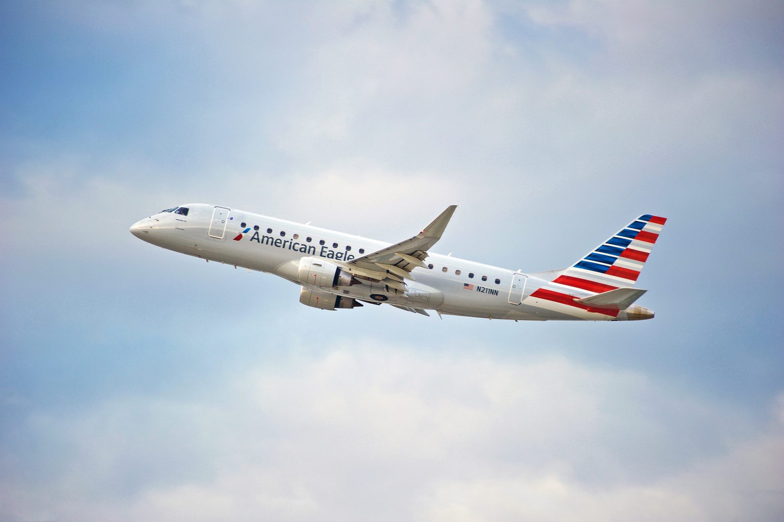 an American Eagle regional jet seen taking off through clouds