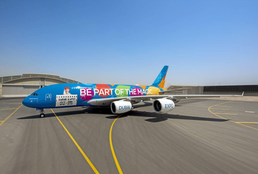 a colorful airplane on a runway