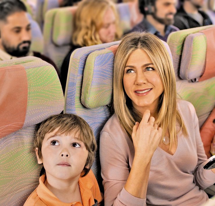 a woman and boy sitting in a bus