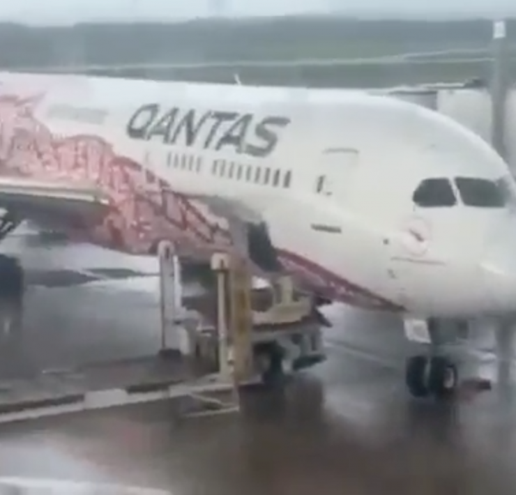 a white airplane in an airport