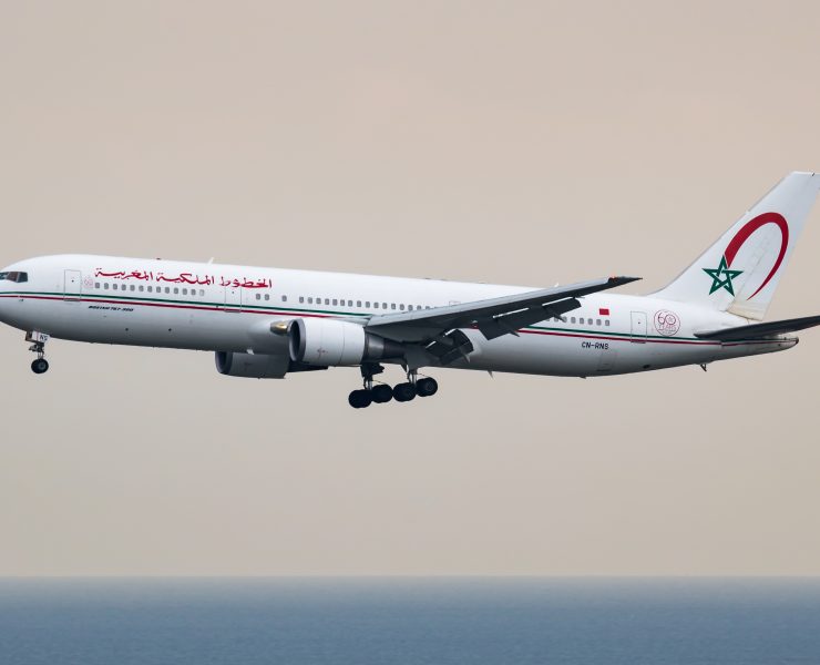 a white airplane flying in the sky