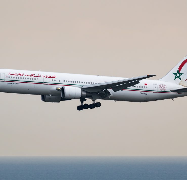 a white airplane flying in the sky