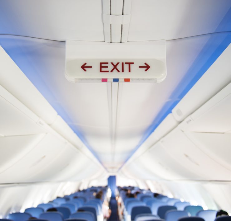 an airplane with an exit sign