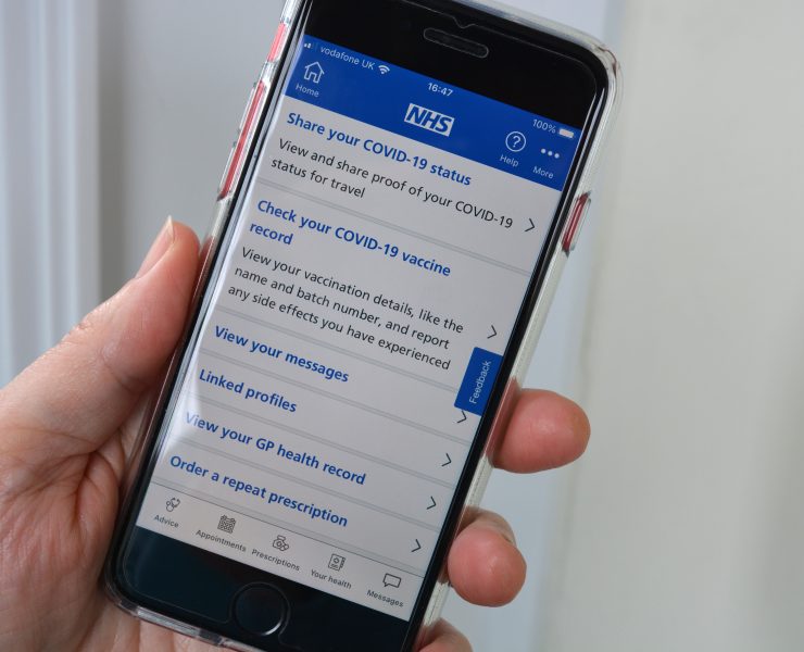 a hand holding a cell phone